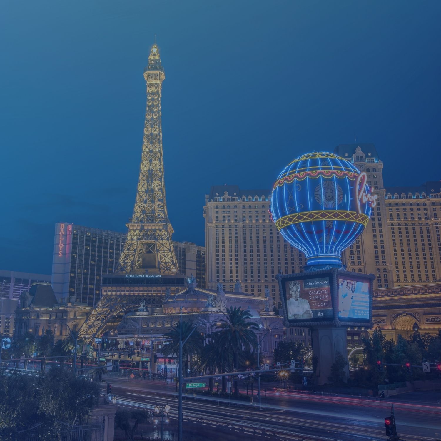 a blue image of the Las Vegas Eiffel Tower and other glamorous views of Vegas